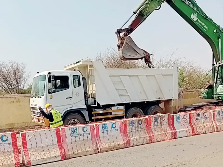 Excavator loading a dump truck