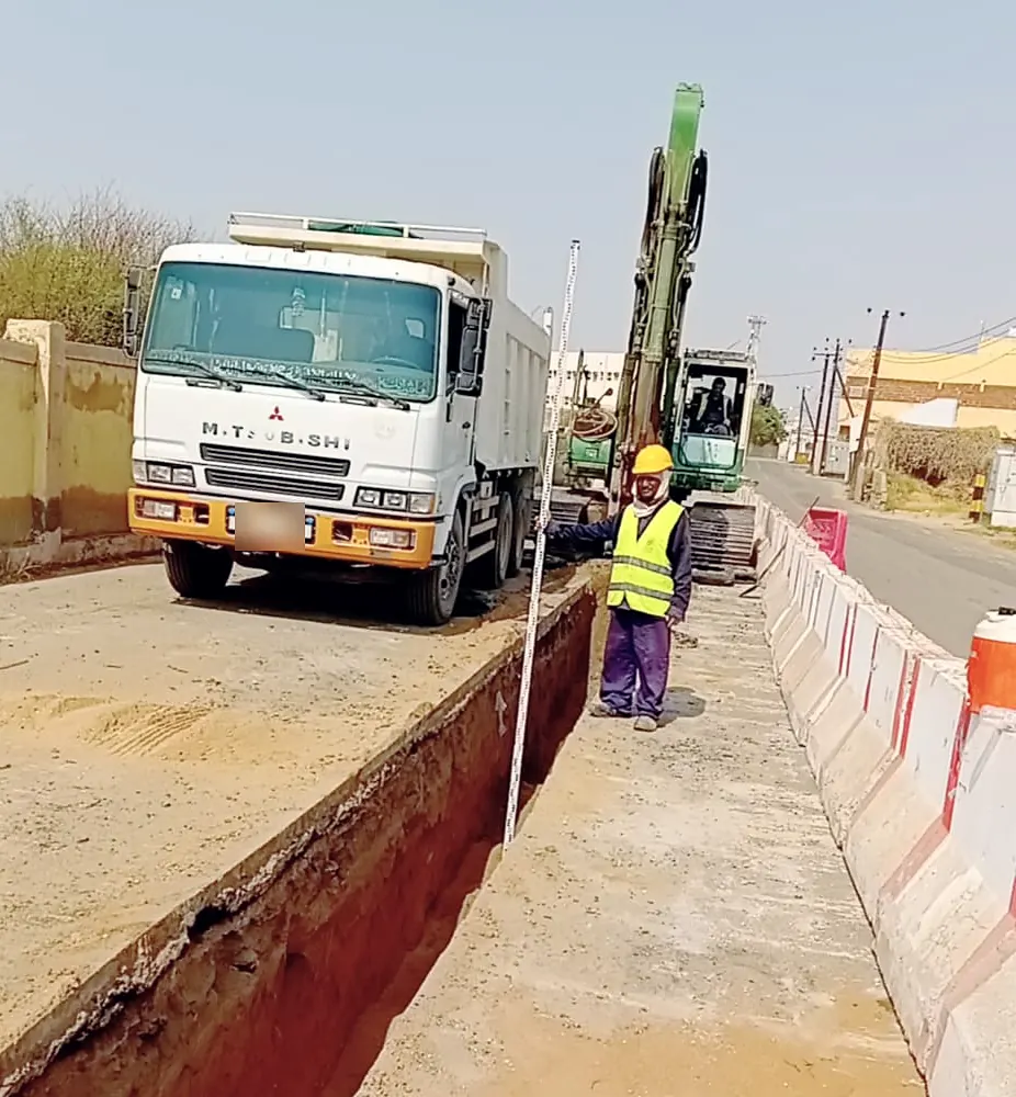 Checking trench depth in Samtah, Jazan