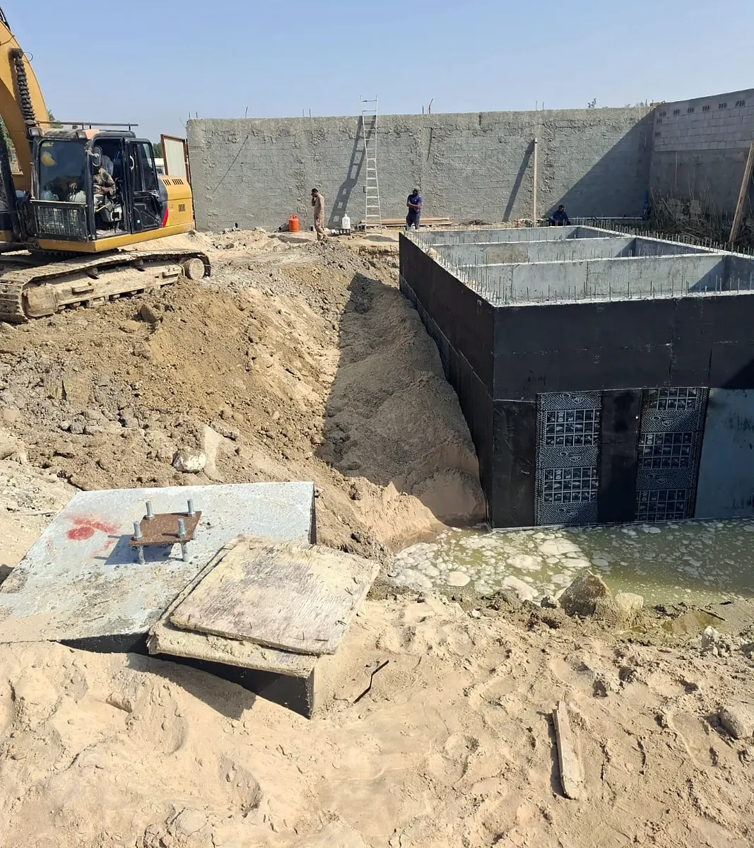 Waterproofed reinforced-concrete tank before backfilling